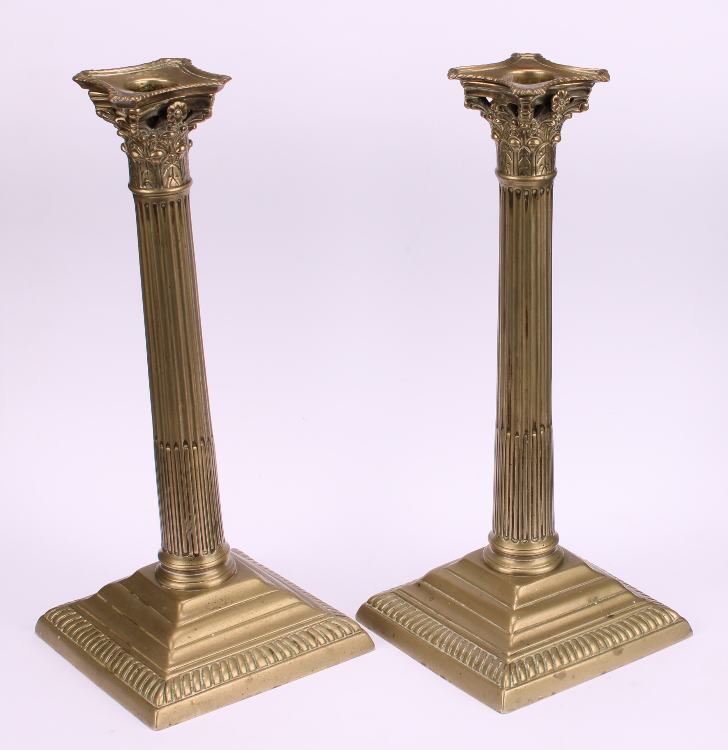 A pair of George III base metal stop-fluted Corinthian column candlesticks, stepped square bases, - Image 3 of 3