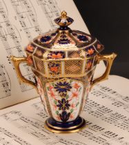 A Royal Crown Derby 1128 Imari pattern hexagonal two-handled pedestal vase and cover, tapering
