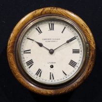 A mid 20th century oak railway or school wall timepiece, 19cm circular clock dial inscribed