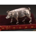 An early 20th century cast silver novelty cannister, as a pig, push-fitting cover, 11cm long, import