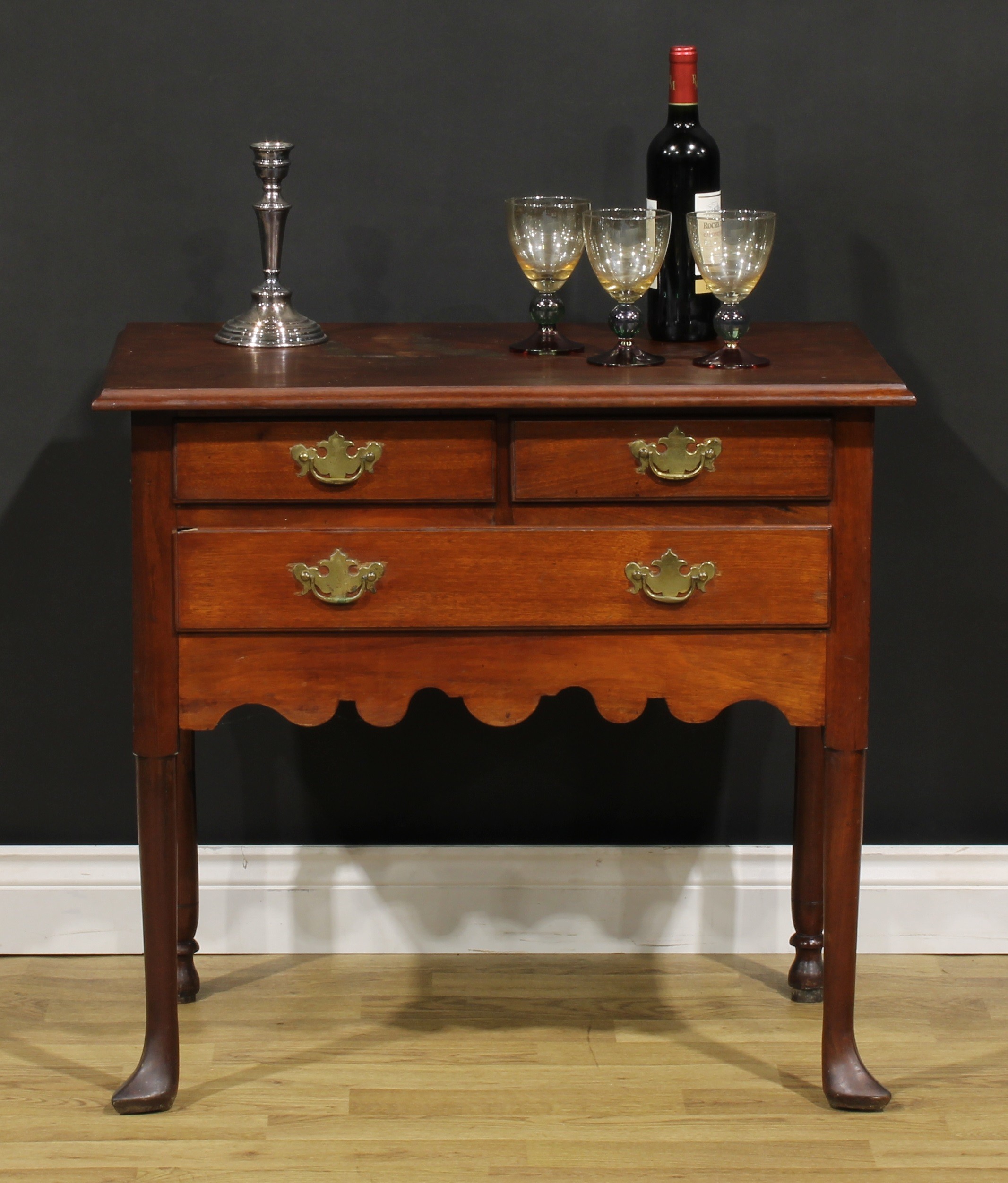 A 19th century American mahogany lowboy, rectangular top above two short and one long drawer, shaped