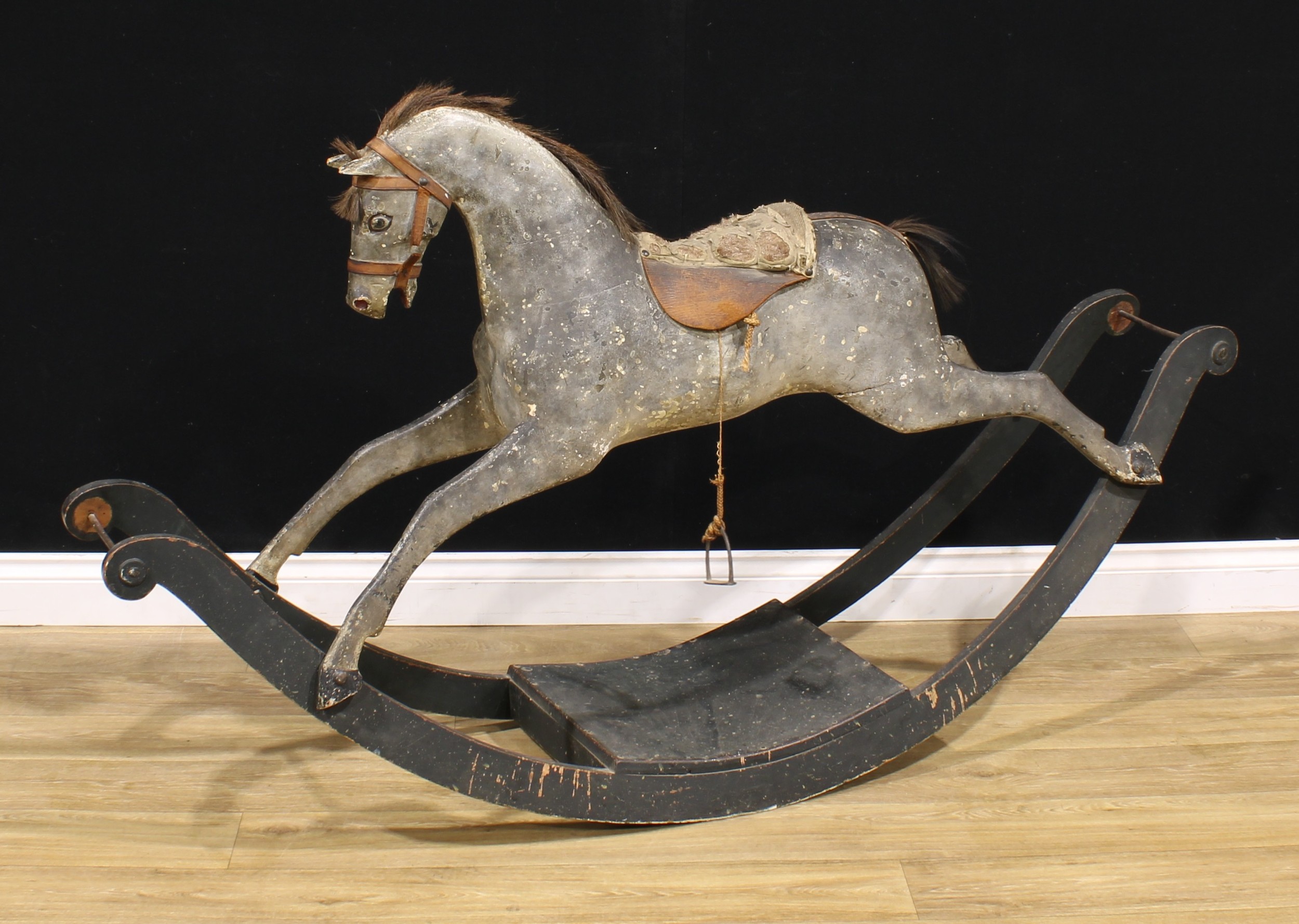 A Victorian rocking horse, sleigh base, 168cm long Provenance: reputedly removed from Friargate