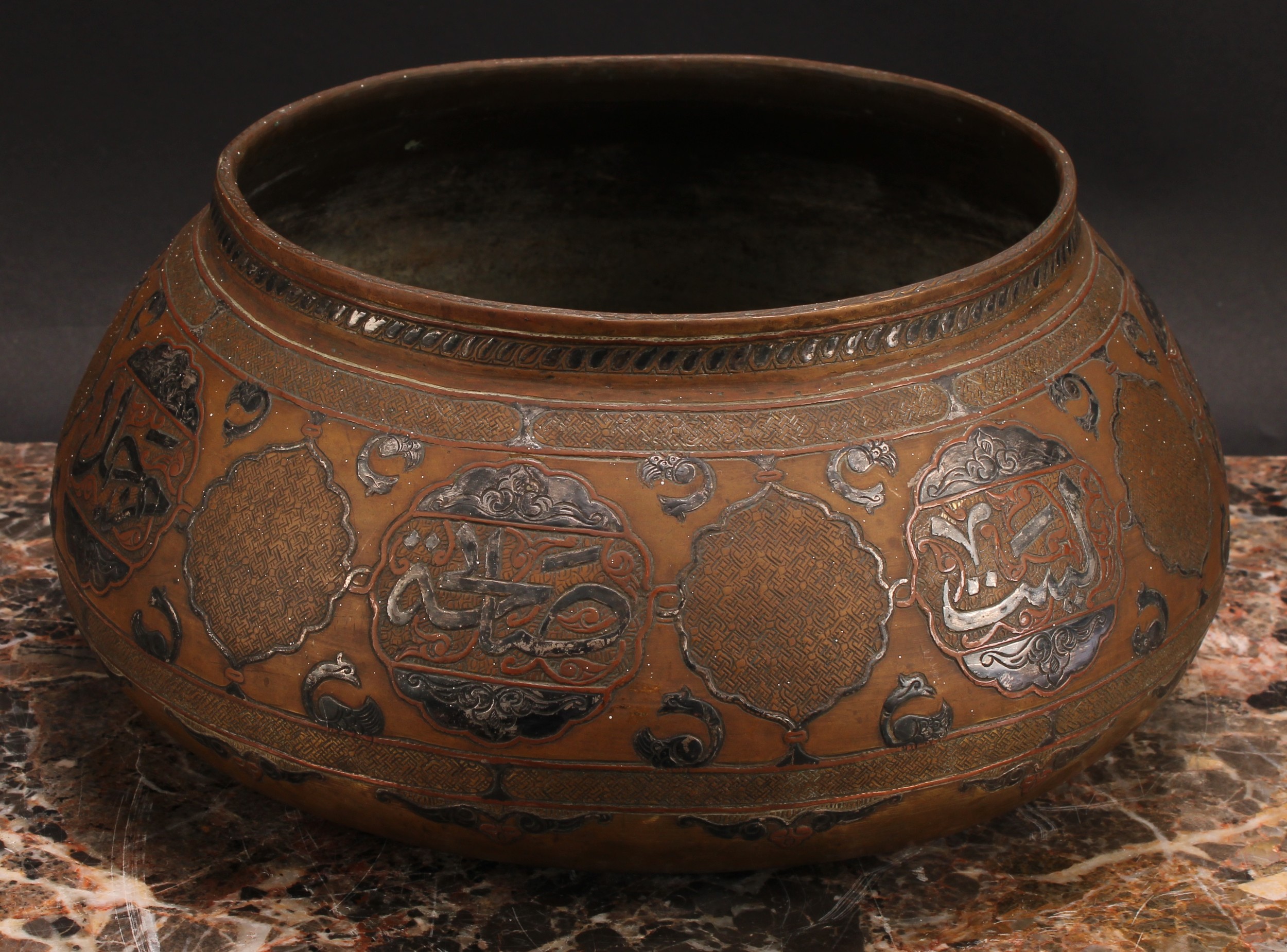 A Middle Eastern silver and copper damascened brass bowl, decorated in the Islamic taste with - Image 2 of 3