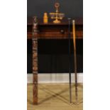 A 19th century walnut pilaster, carved with a herm and pendants, 91cm long; a French boxwood treen