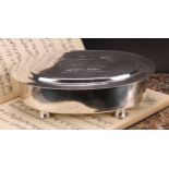 A large George VI silver oval box and cover, of 17th century design, domed cover enclosing twin-