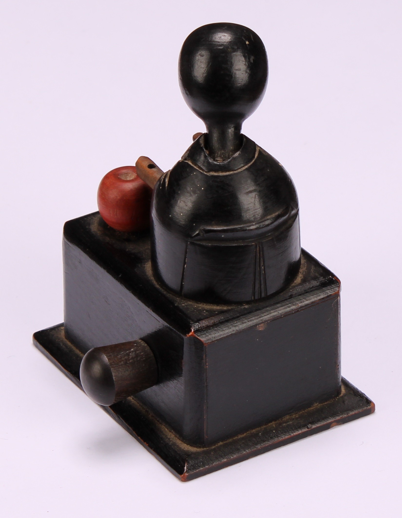 A Japanese Kobe mechanical wooden toy, as a comical figure eating an apple, rectangular base, 9cm - Image 4 of 4