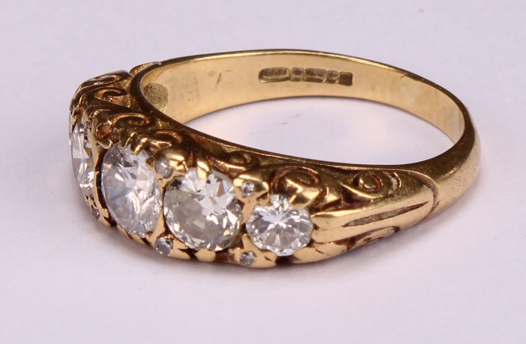 An 18ct gold five stone diamond ring, the graduated stones interspersed with diamond chips, - Image 3 of 4