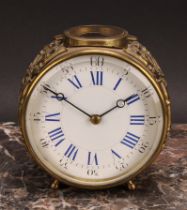 An early 20th century French brass circular carriage type timepiece, 9cm enamel clock dial inscribed