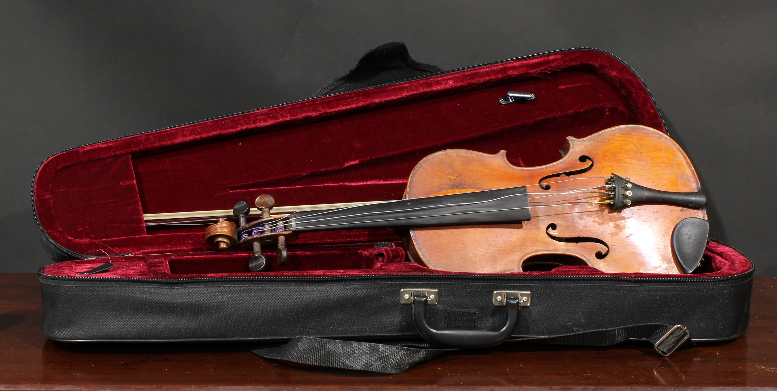 A German violin, the two-piece back 36cm long excluding button, paper label printed Manufactured