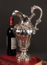 A large George IV silver fluted baluster wine ewer, applied with a bold band of fruiting vine,