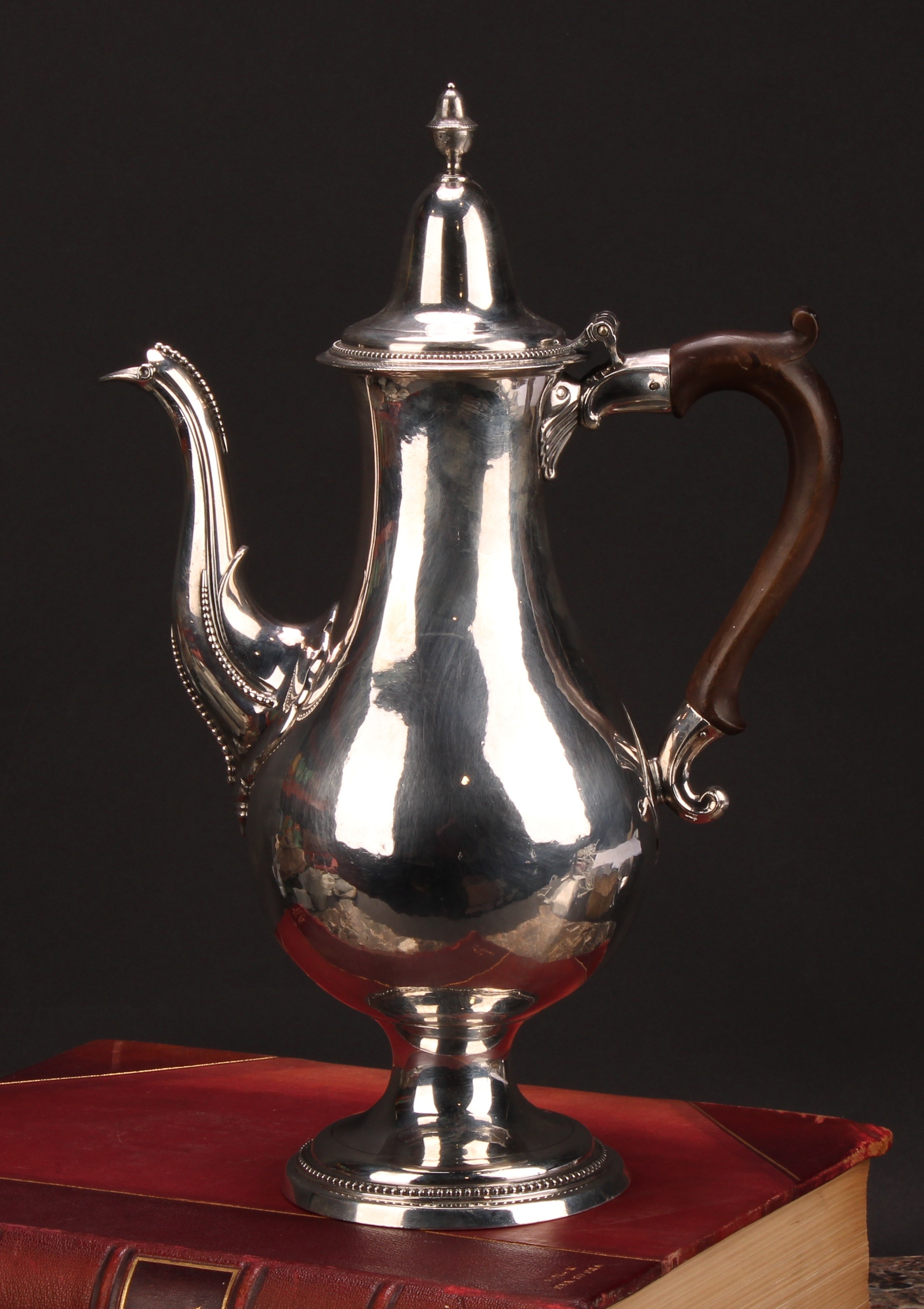 A George III provincial silver baluster coffee pot, hinged lofty domed cover with acorn finial,