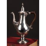 A George III provincial silver baluster coffee pot, hinged lofty domed cover with acorn finial,