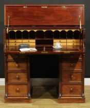 A Victorian mahogany secretaire kneehole desk, hinged top and fall front enclosing a tooled and gilt