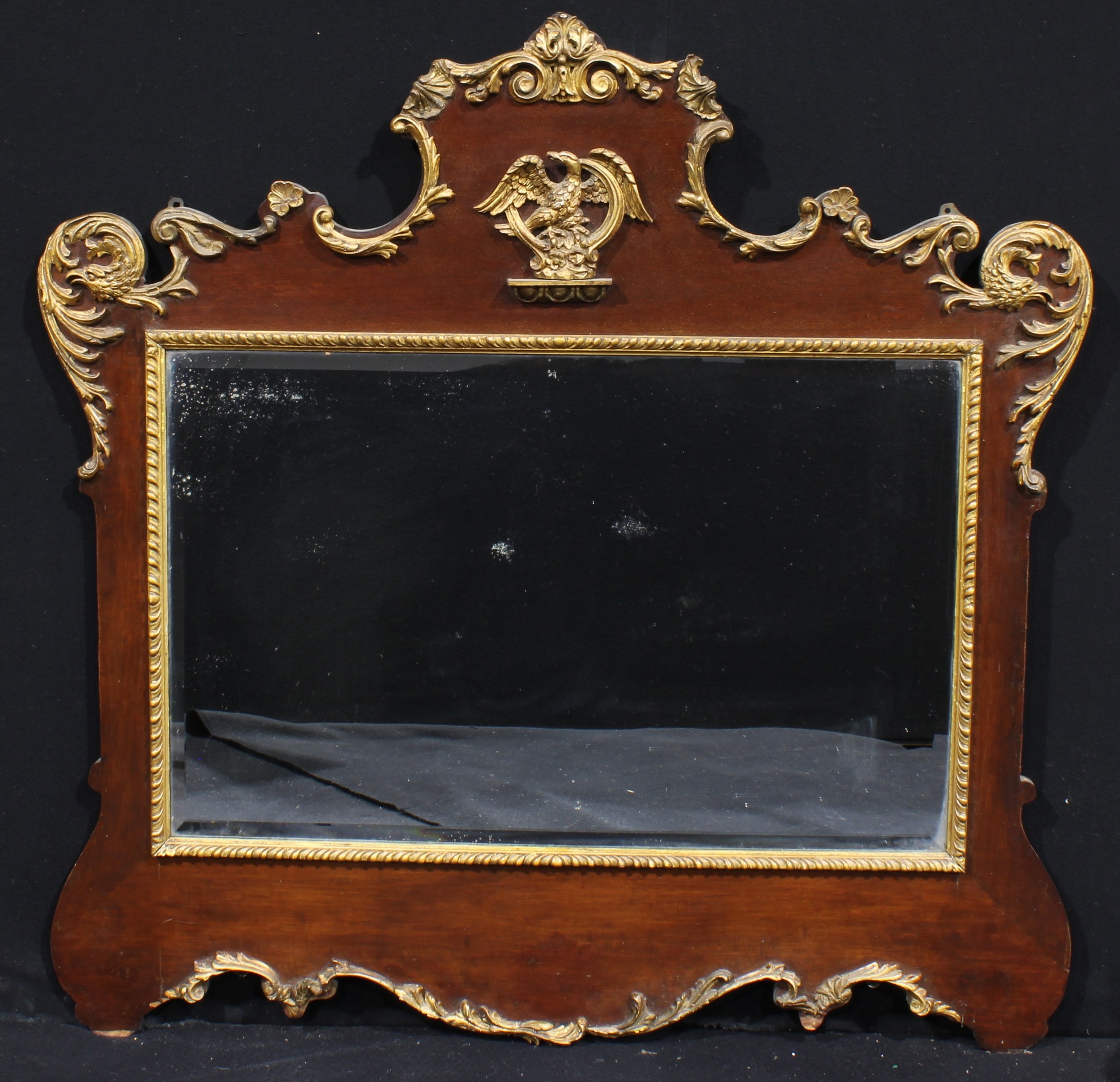 A Chippendale Revival mahogany and parcel-gilt overmantel or pier glass, bevelled mirror plate,