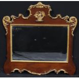 A Chippendale Revival mahogany and parcel-gilt overmantel or pier glass, bevelled mirror plate,