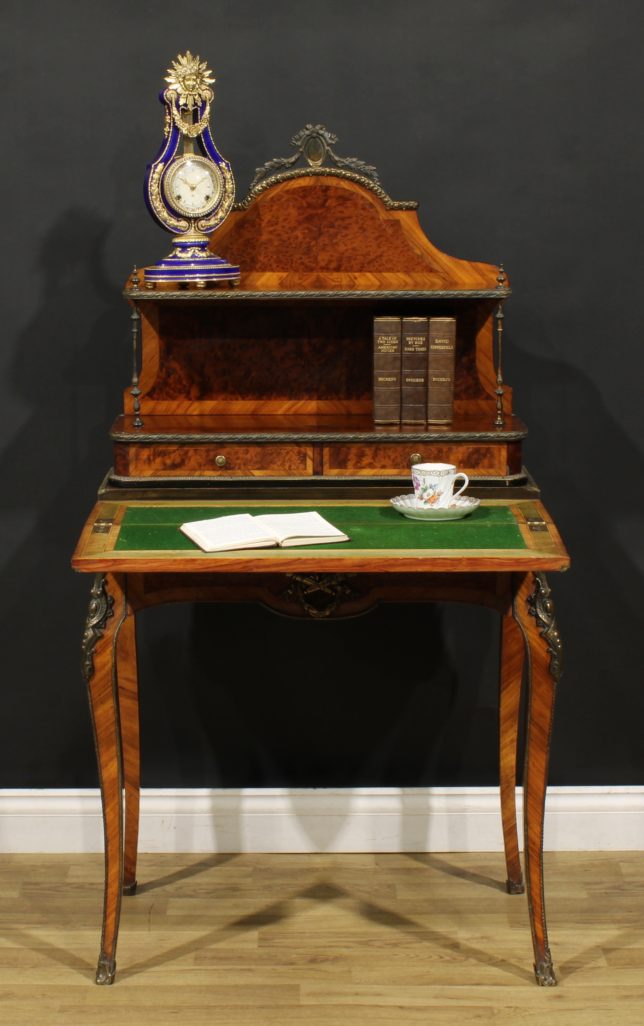 A Louis XV Revival amboyna and kingwood bonheur du jour, shaped superstructure with a shelf and