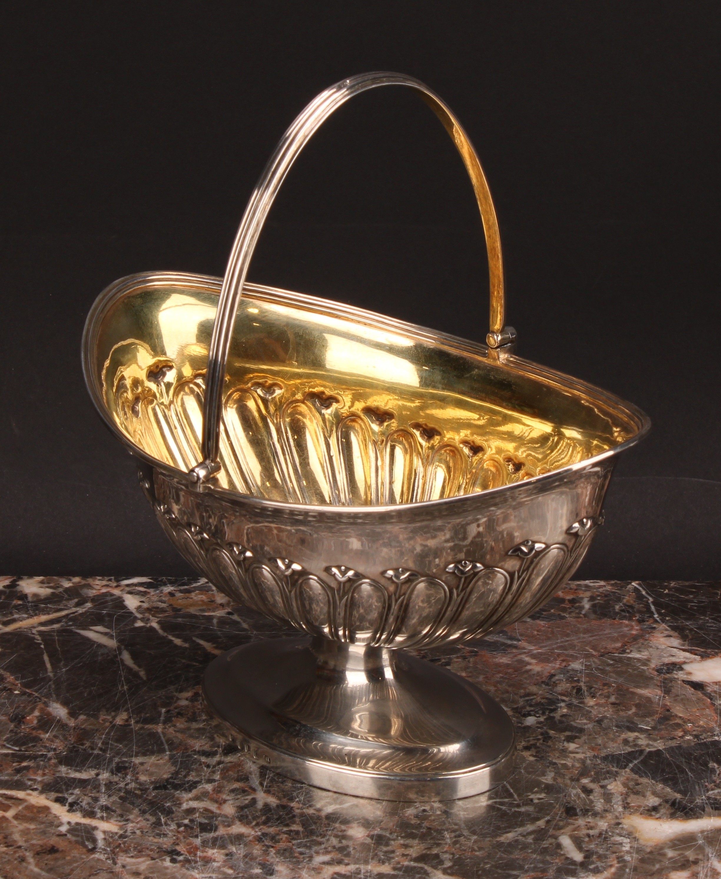 An unusually large George III silver half-fluted boat shaped pedestal sugar basket, swing handle, - Image 3 of 5