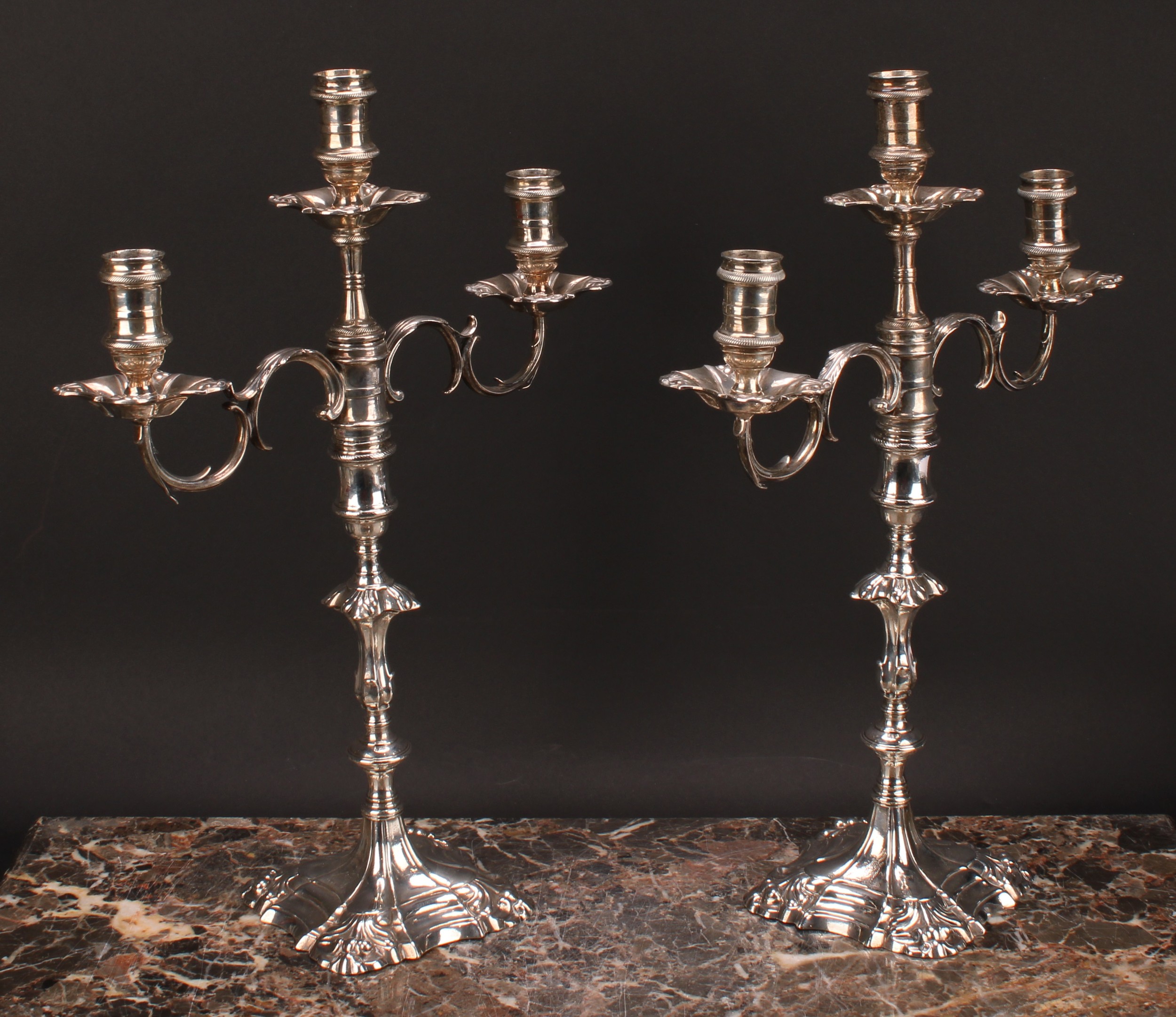 A pair of George II cast silver table candlesticks, fitted with Victorian three-light candelabra - Image 3 of 4