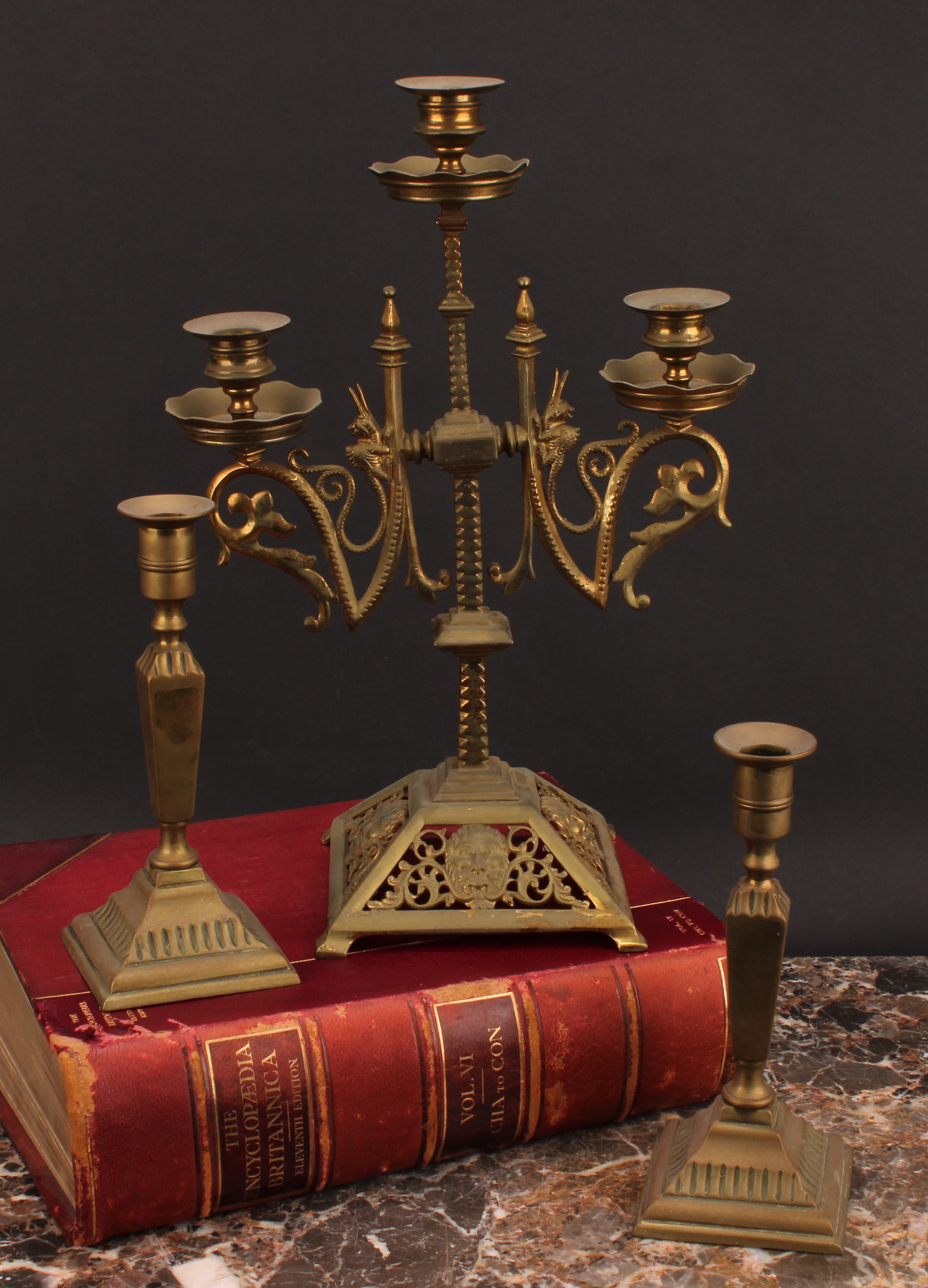 A 19th century gilt brass three-light candelabrum, pierced and cast with foliate masks, 37cm high,