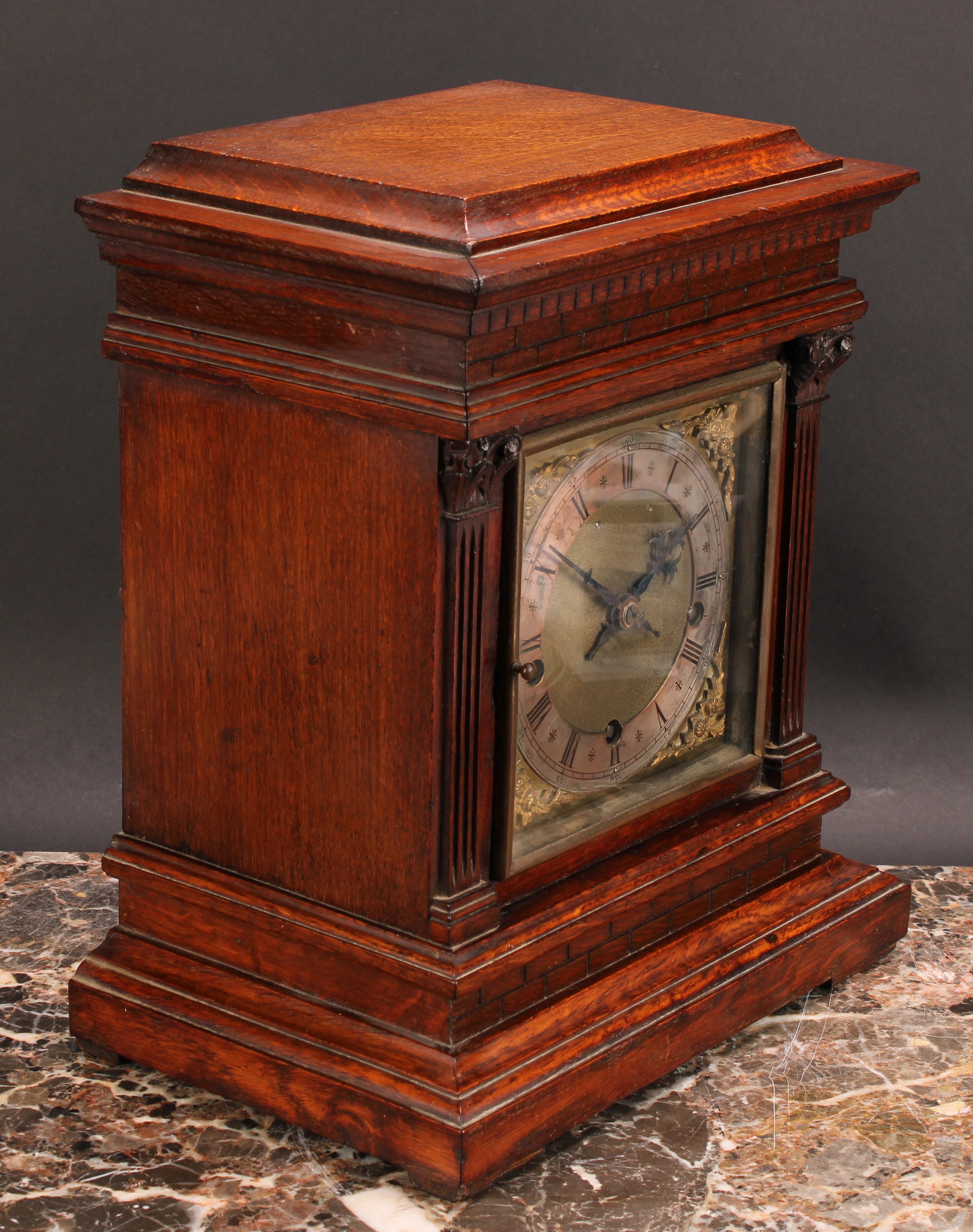 An early 20th century oak architectural bracket-form mantel clock, 15cm square brass dial with - Image 2 of 4