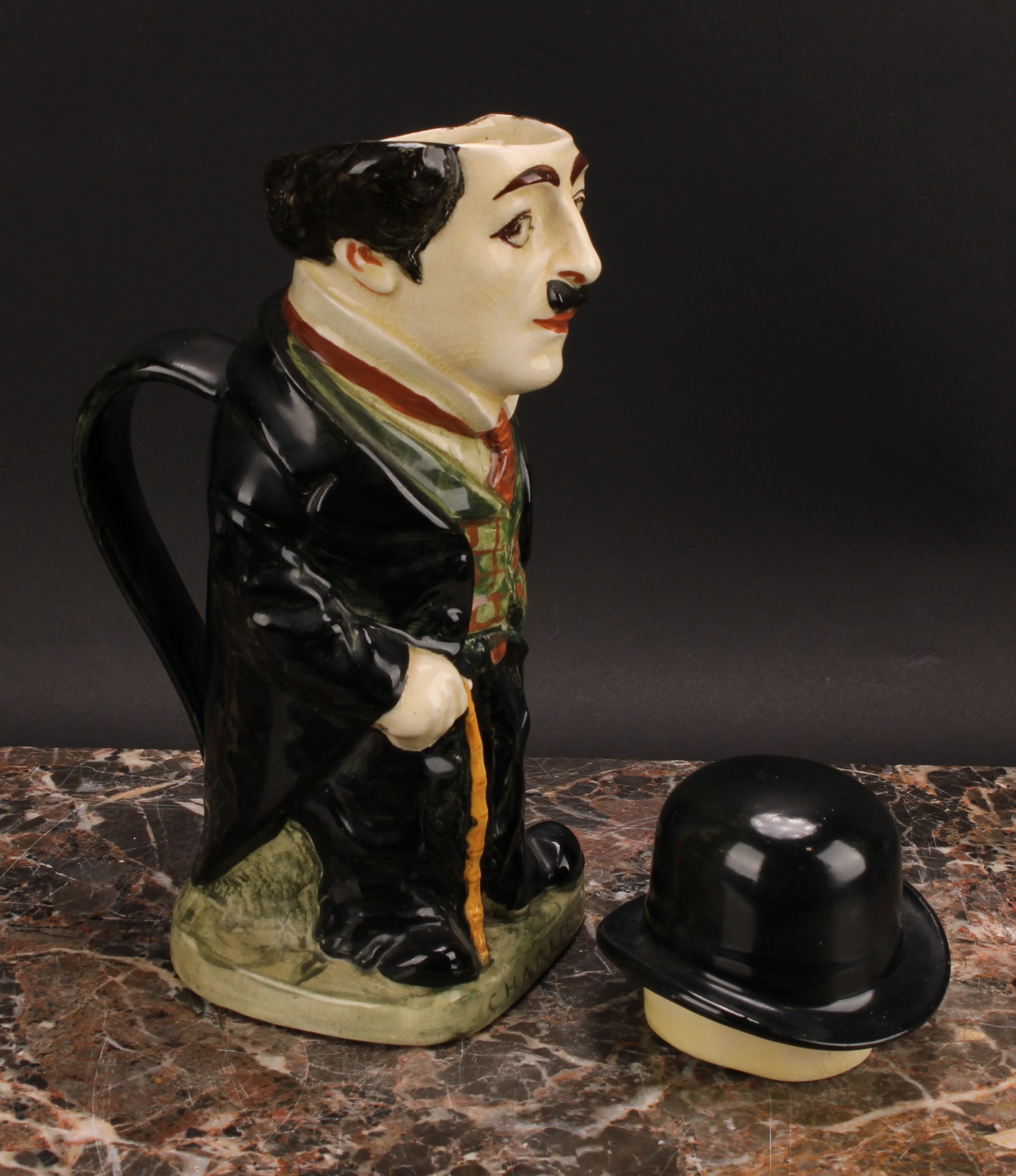 A Royal Doulton jug and cover, modelled as Charlie Chaplin, he stands wearing baggy black suit - Bild 4 aus 7