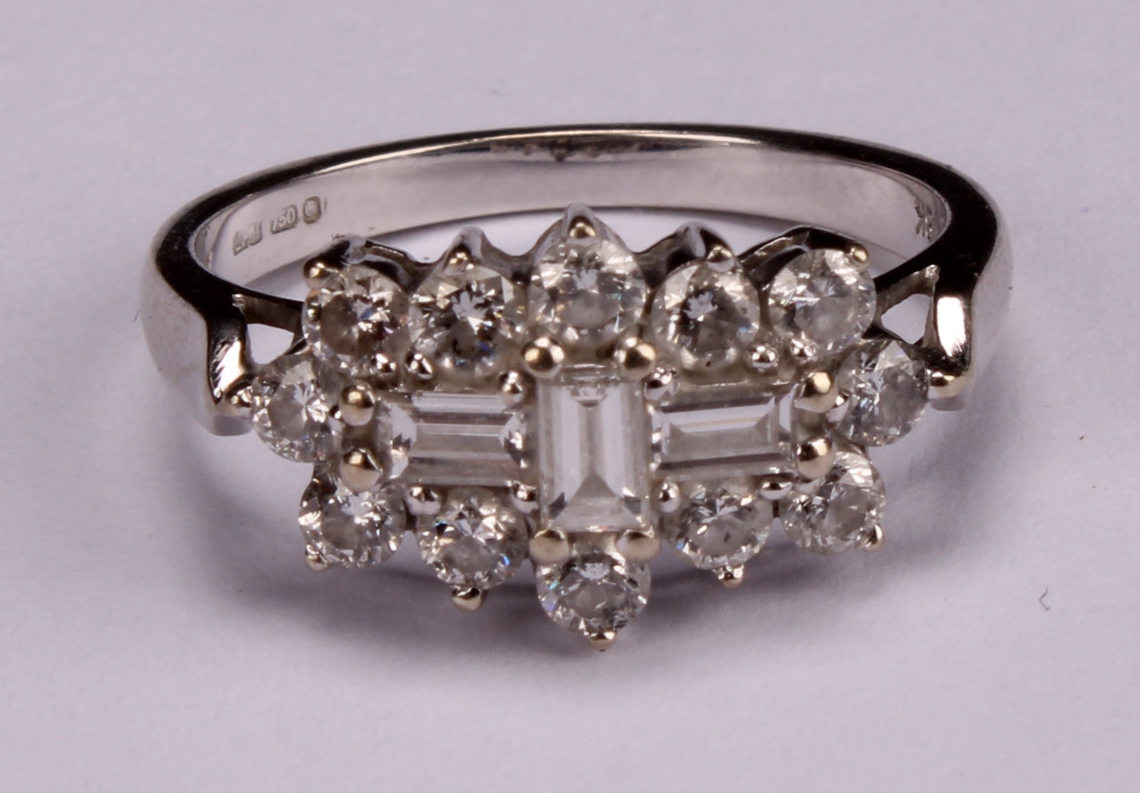 An 18k white gold diamond ring, set with three central baguette cut stones, flanked with twelve - Image 4 of 4