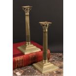 A pair of George III base metal stop-fluted Corinthian column candlesticks, stepped square bases,