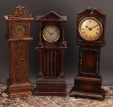 An early 20th century oak miniature longcase clock, 6.5cm circular silvered dial inscribed with