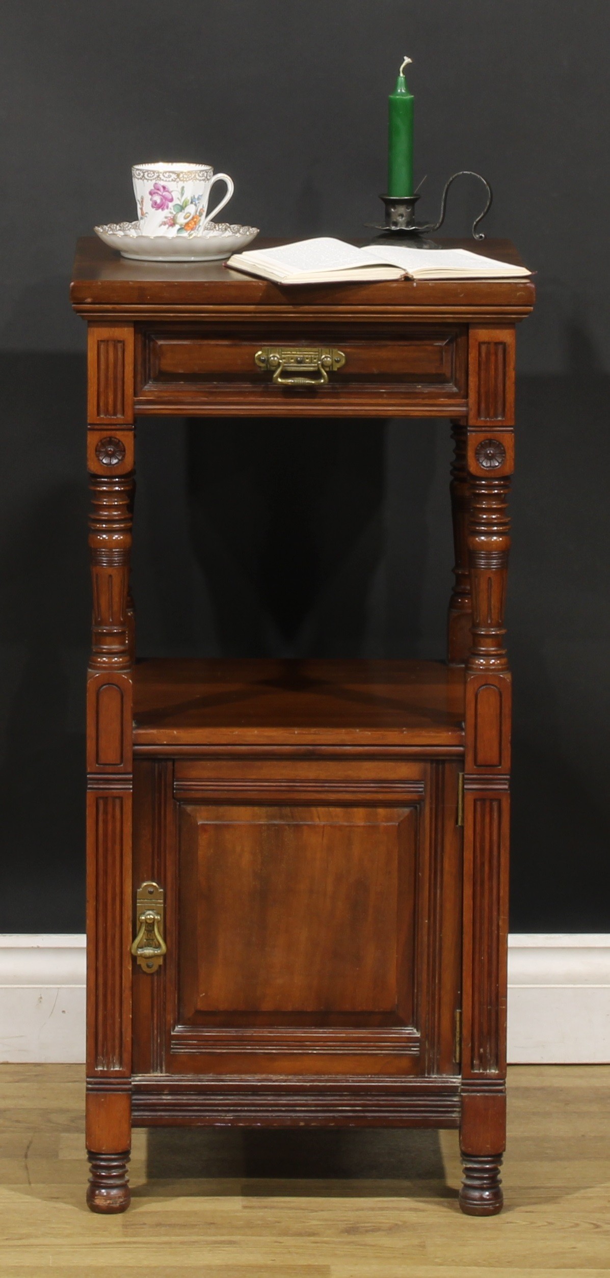 An Aesthetic Movement walnut bedroom cabinet, by Gillows of Lancaster and London, stamped L14946,