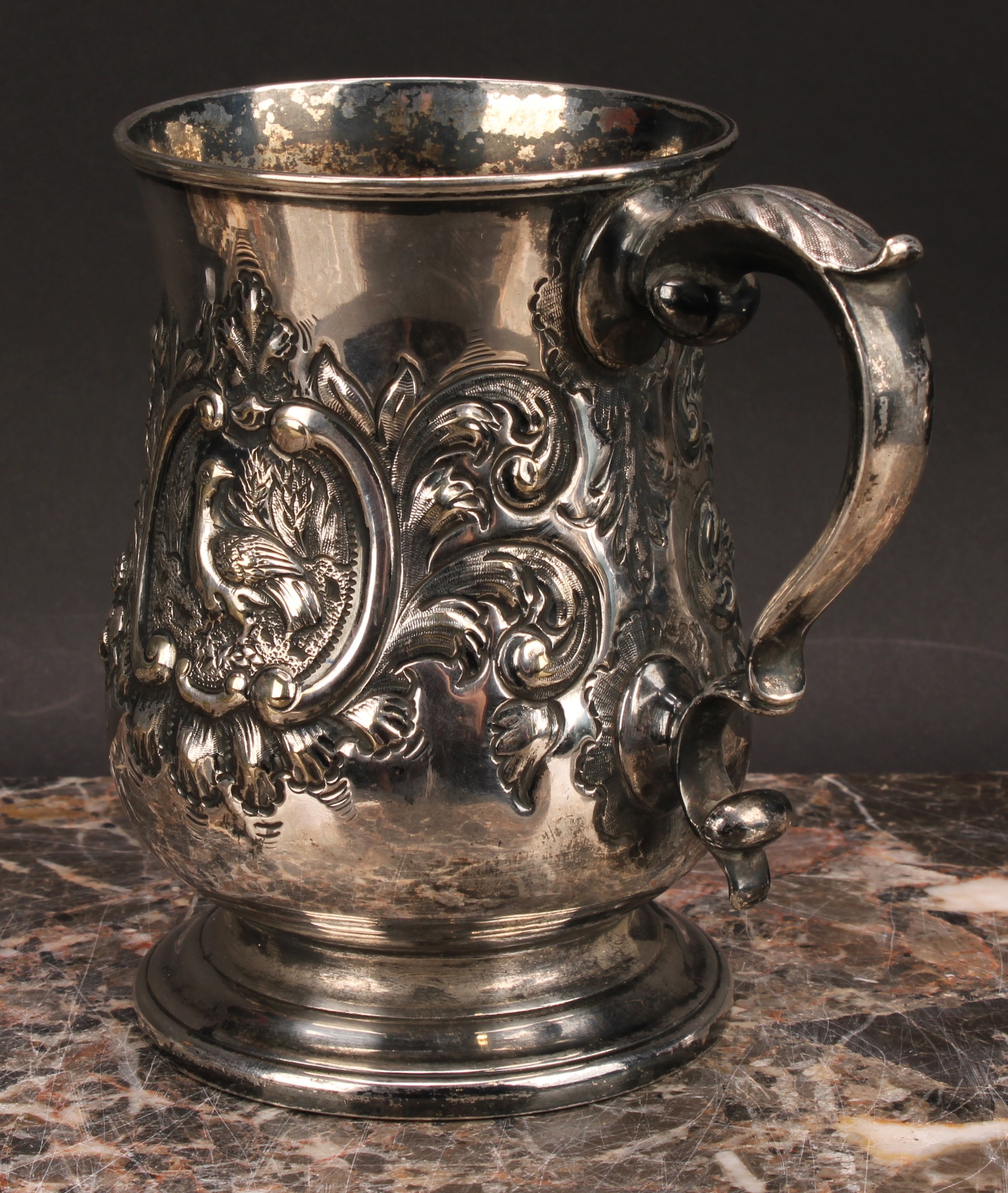 A Victorian E.P.N.S bell shaped mug, chased with birds within C-scroll cartouches flanked by - Image 4 of 4