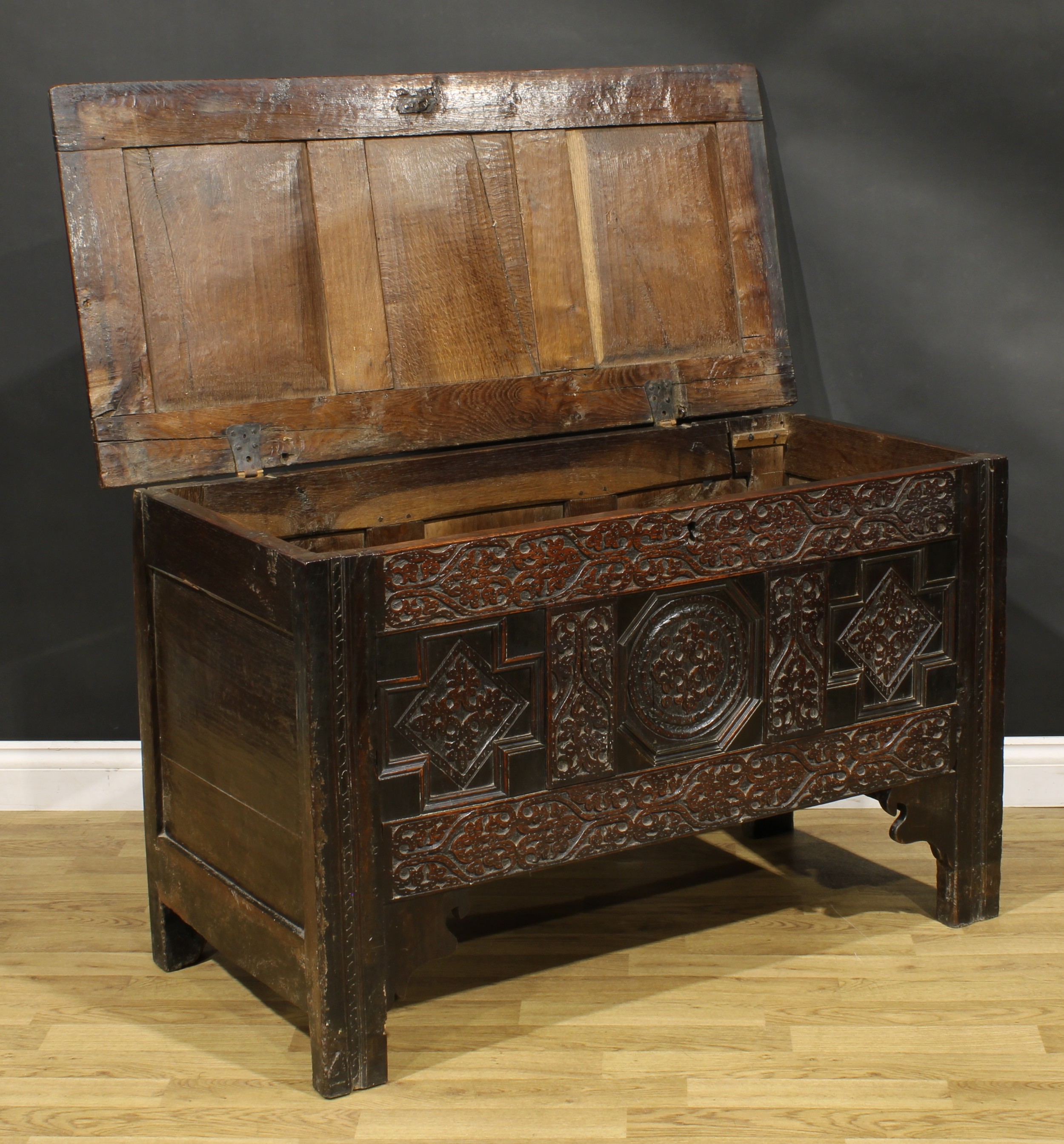 A Charles II oak three panel blanket chest, hinged top, the front profusely carved with leafy - Image 3 of 5