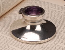 A George V silver and guilloche enamel capstan inkwell, hinged cover decorated in tones of purple,