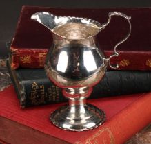 A George III silver baluster cream jug, acanthus-capped scroll handle, crimped borders, 11cm high,