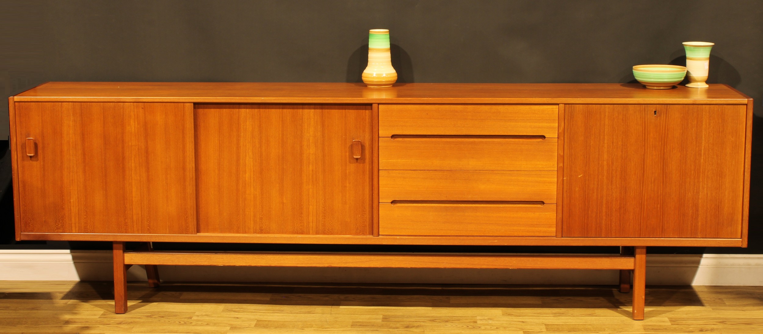 A large mid-20th century Swedish teak sideboard, by Nils Jonsson for Troeds, 78cm high, 252.5cm
