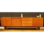 A large mid-20th century Swedish teak sideboard, by Nils Jonsson for Troeds, 78cm high, 252.5cm