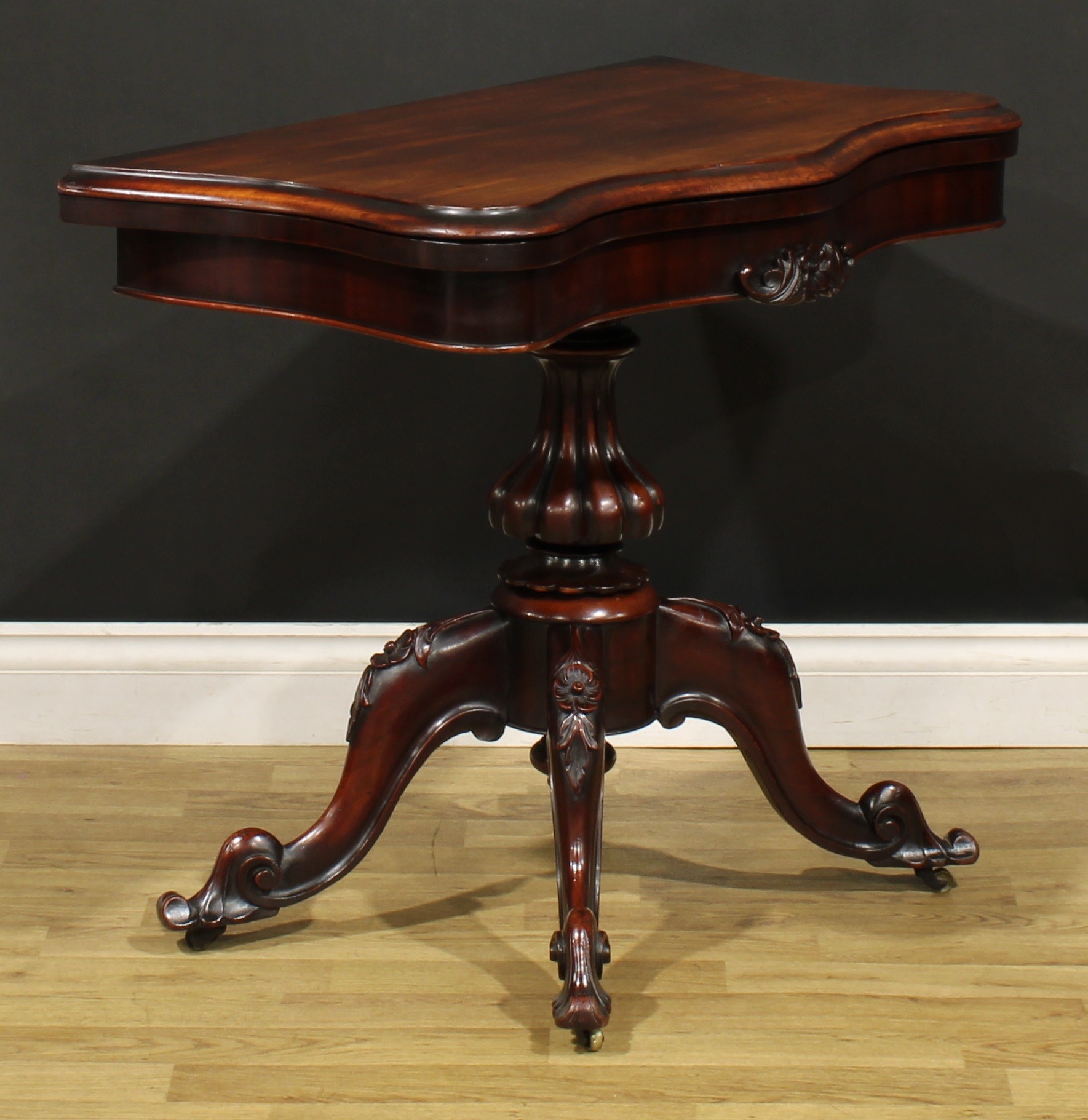 A Victorian mahogany serpentine card table, hinged top with moulded edge enclosing a baize lined - Image 4 of 6