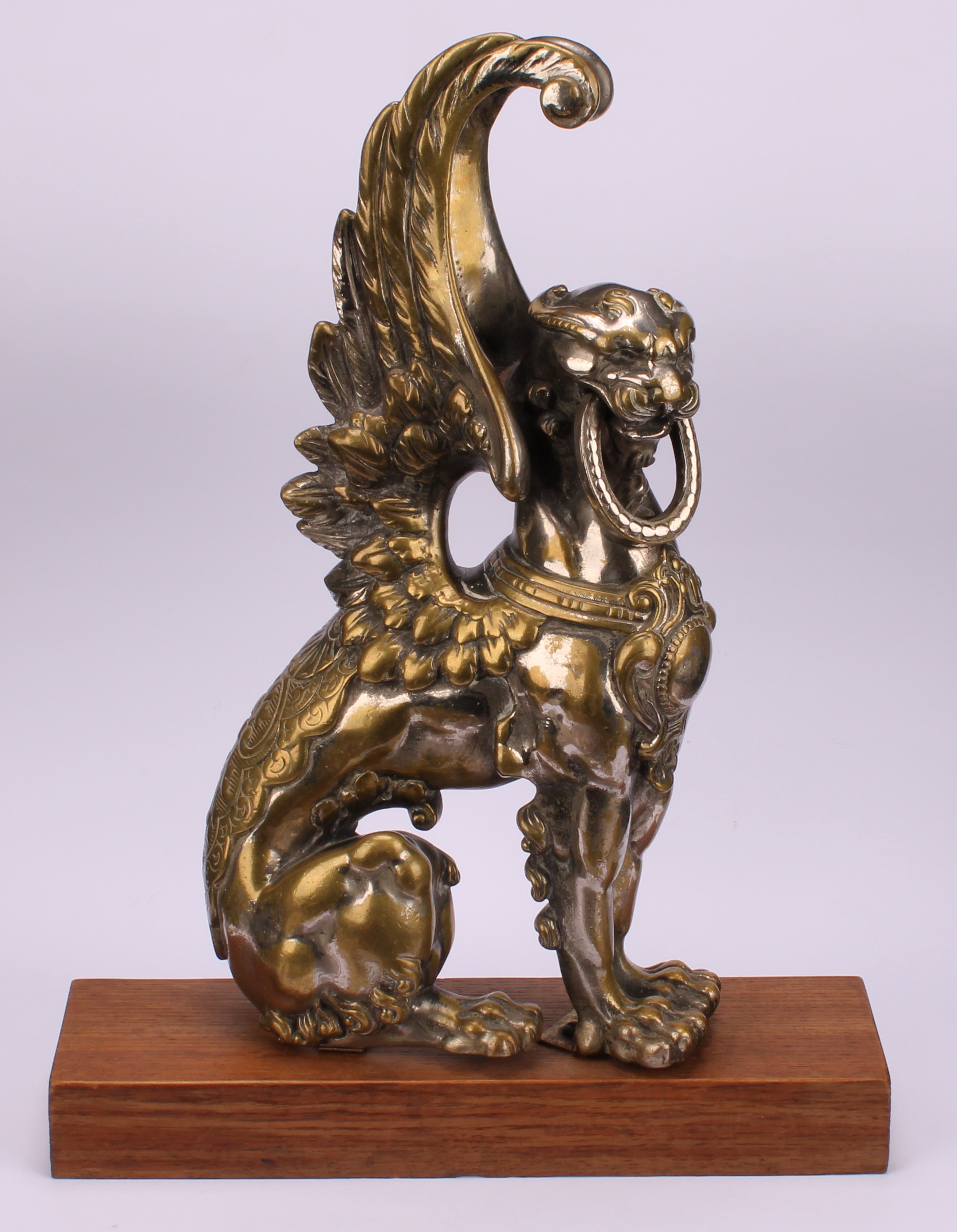 A 19th century parcel-silvered model, cast as a winged lion, 31cm high, hardwood plinth, 35cm high - Image 2 of 4