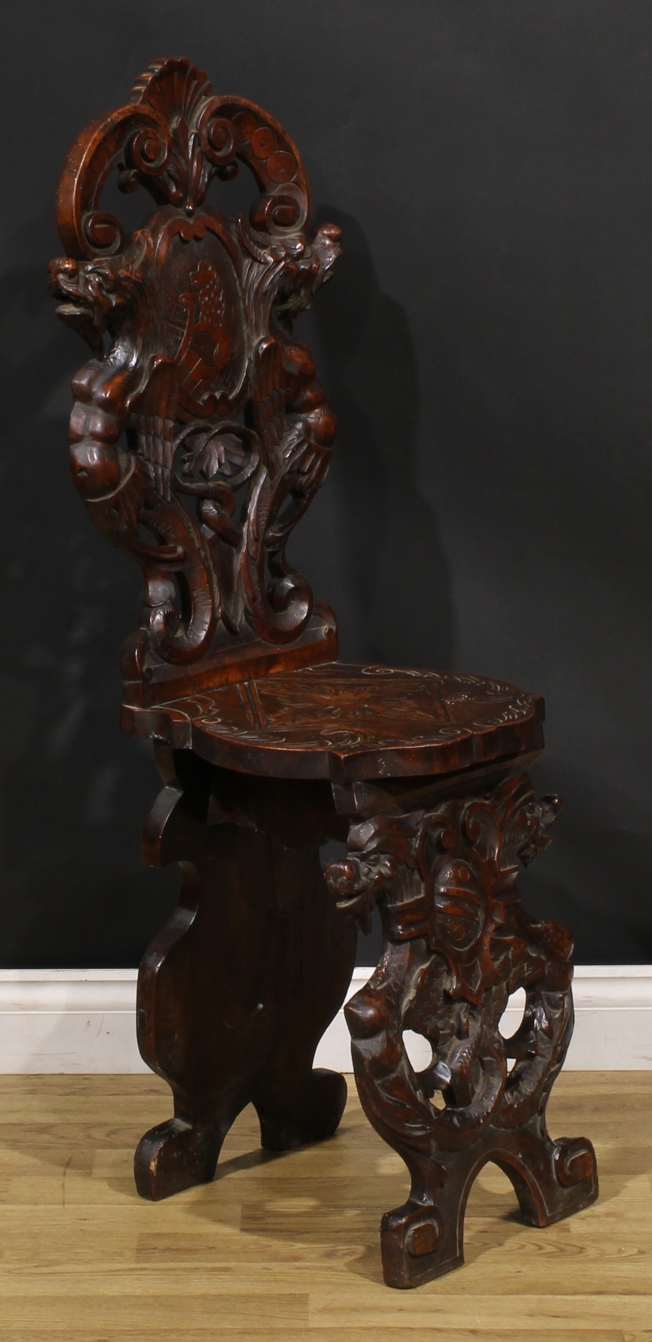A pair of 19th century Italian walnut sgabelli or hall chairs, carved throughout in the - Image 7 of 9