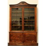 A 19th century Adam Revival mahogany library bookcase, arched cresting carved and applied with a