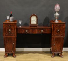 A Regency mahogany twin pedestal sideboard, possibly Scottish and of small proportions, lion mask