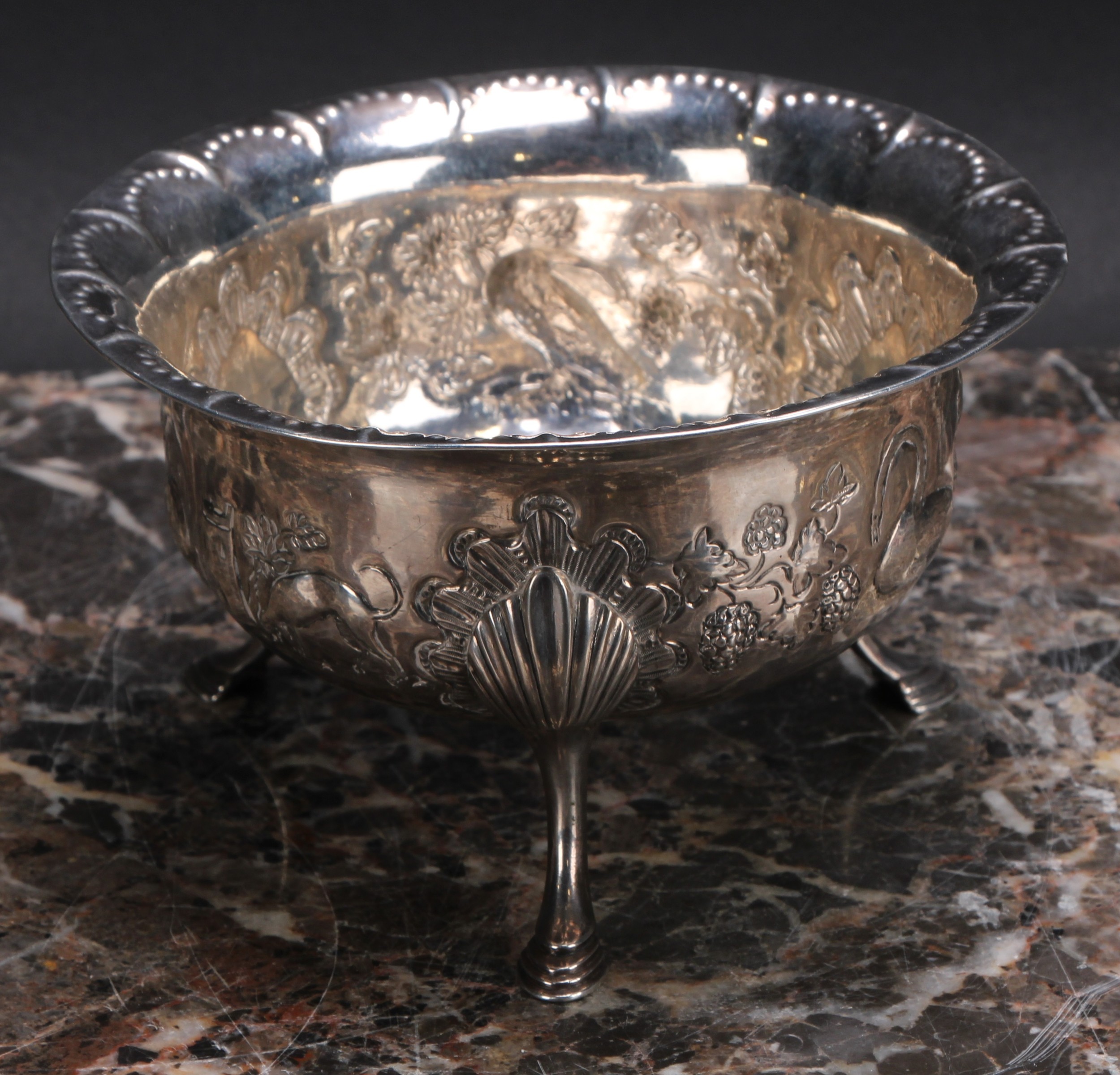 An Irish Provincial silver bowl, chased with a bird, a rabbit, a dog and a swan, in a landscape, - Bild 2 aus 3