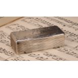 A 19th century French silver rounded rectangular snuff box, hinged cover chased with a cartouche and