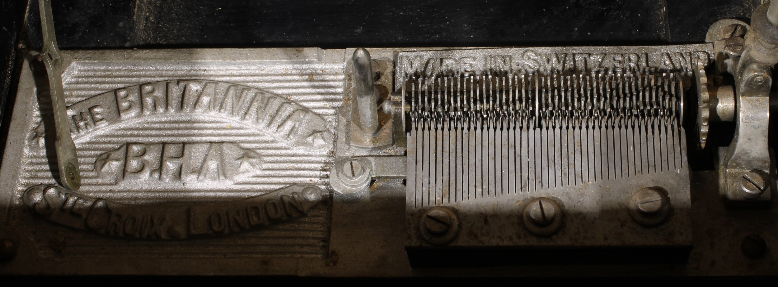 A late 19th century parcel-ebonised walnut symphonion, horizontal mechanism playing 23cm discs, - Image 4 of 4