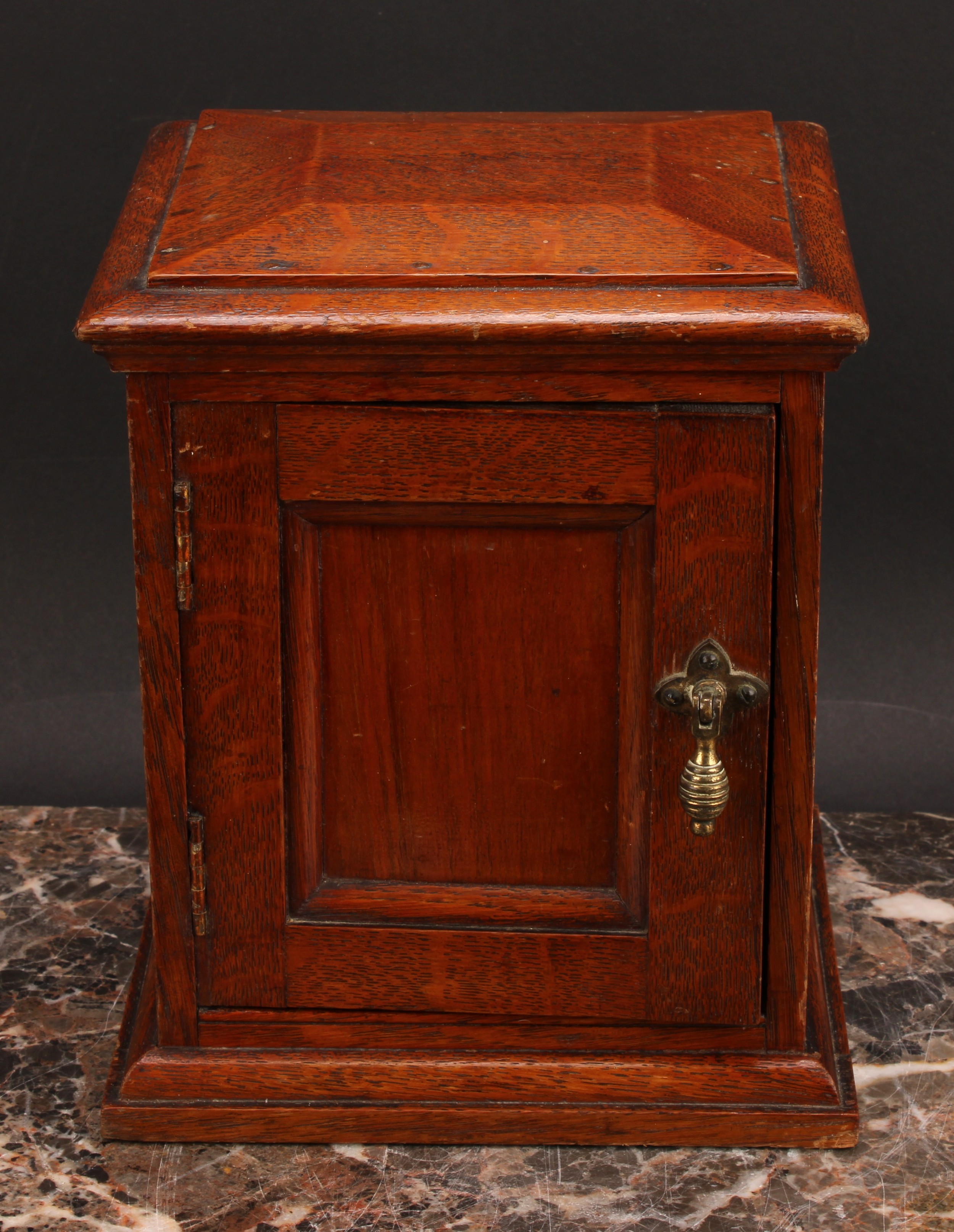 A Victorian oak table top cabinet, sarcophagus top above a panelled door enclosing three collector's - Image 2 of 5