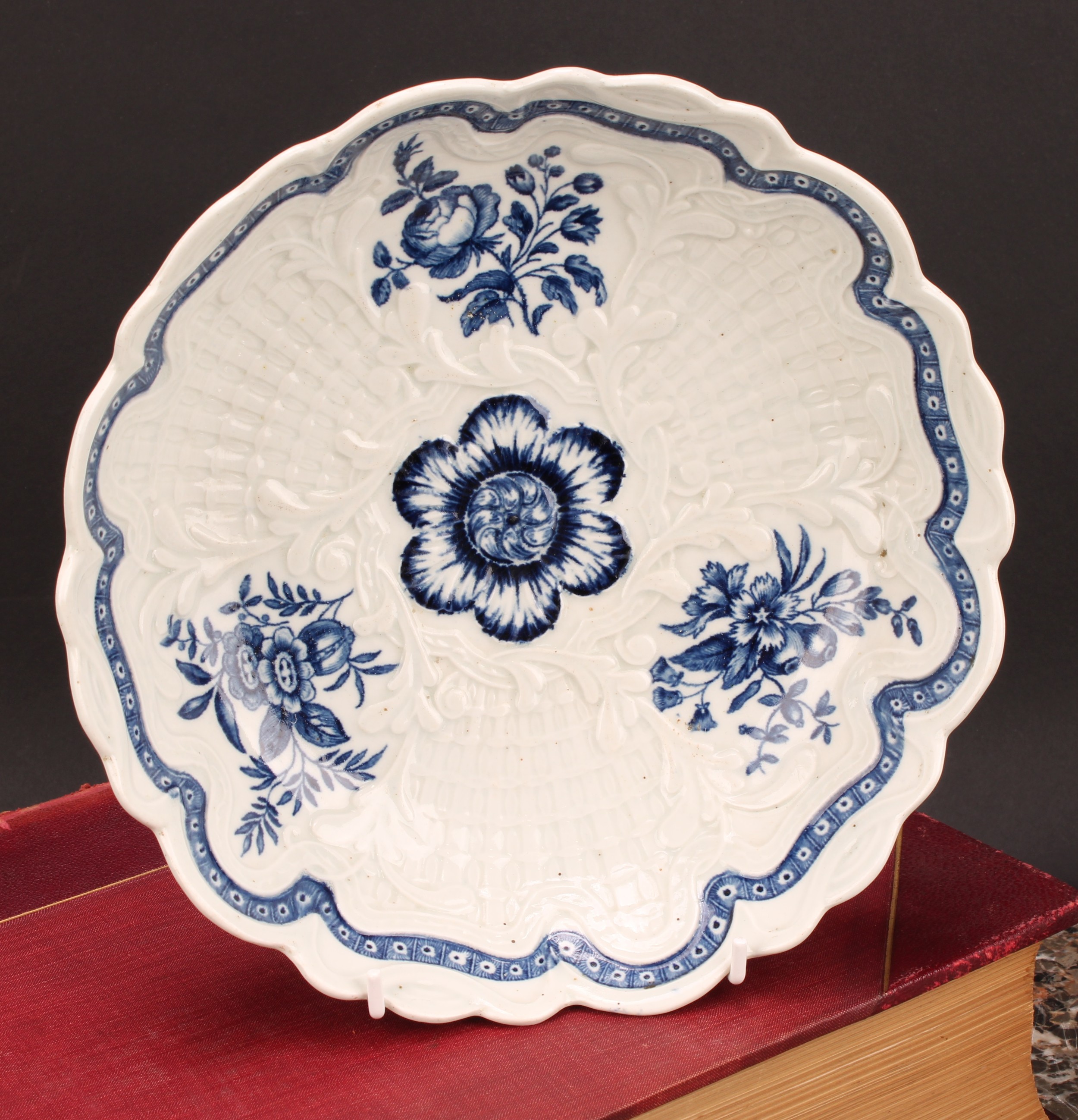 A Worcester shaped circular junket dish, moulded in relief with foliage and basketwork, decorated in