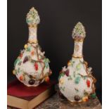 A pair of Meissen schneeballen bottle vases and covers, typically encrusted and applied with birds