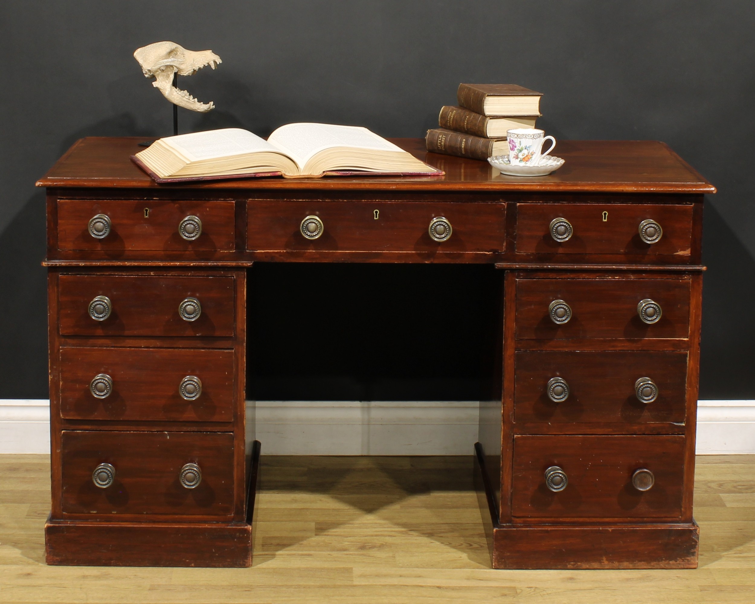 A late Victorian mahogany twin pedestal desk, by Heal & Son, London, rectangular top above an