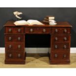A late Victorian mahogany twin pedestal desk, by Heal & Son, London, rectangular top above an