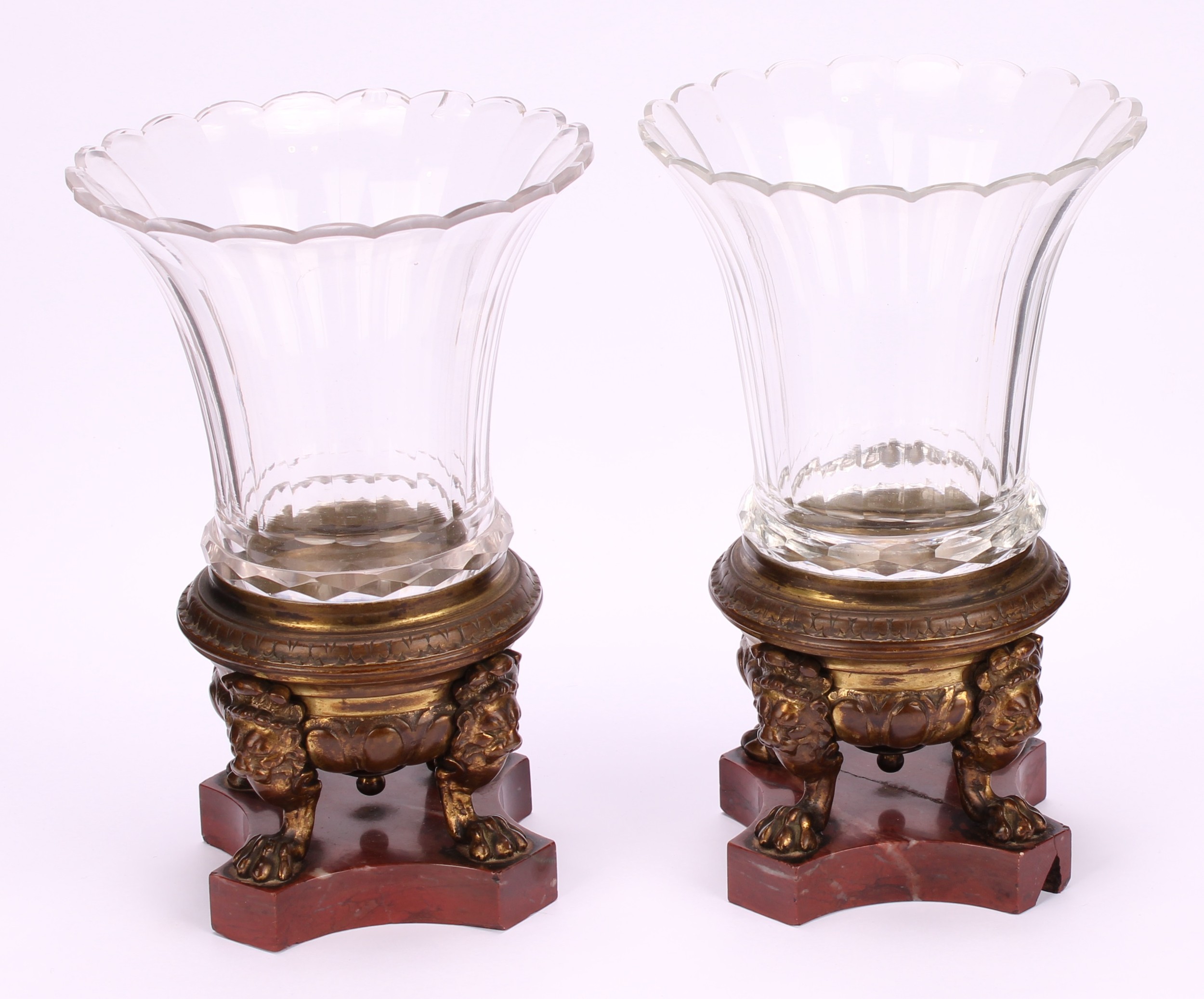 A 19th century pair of gilt bronze and clear glass mantel urns, cast lion monopodia, incurved canted - Image 2 of 6