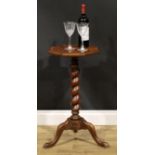 A 19th century laburnum and walnut candle stand, oyster-veneered octagonal top, spirally turned